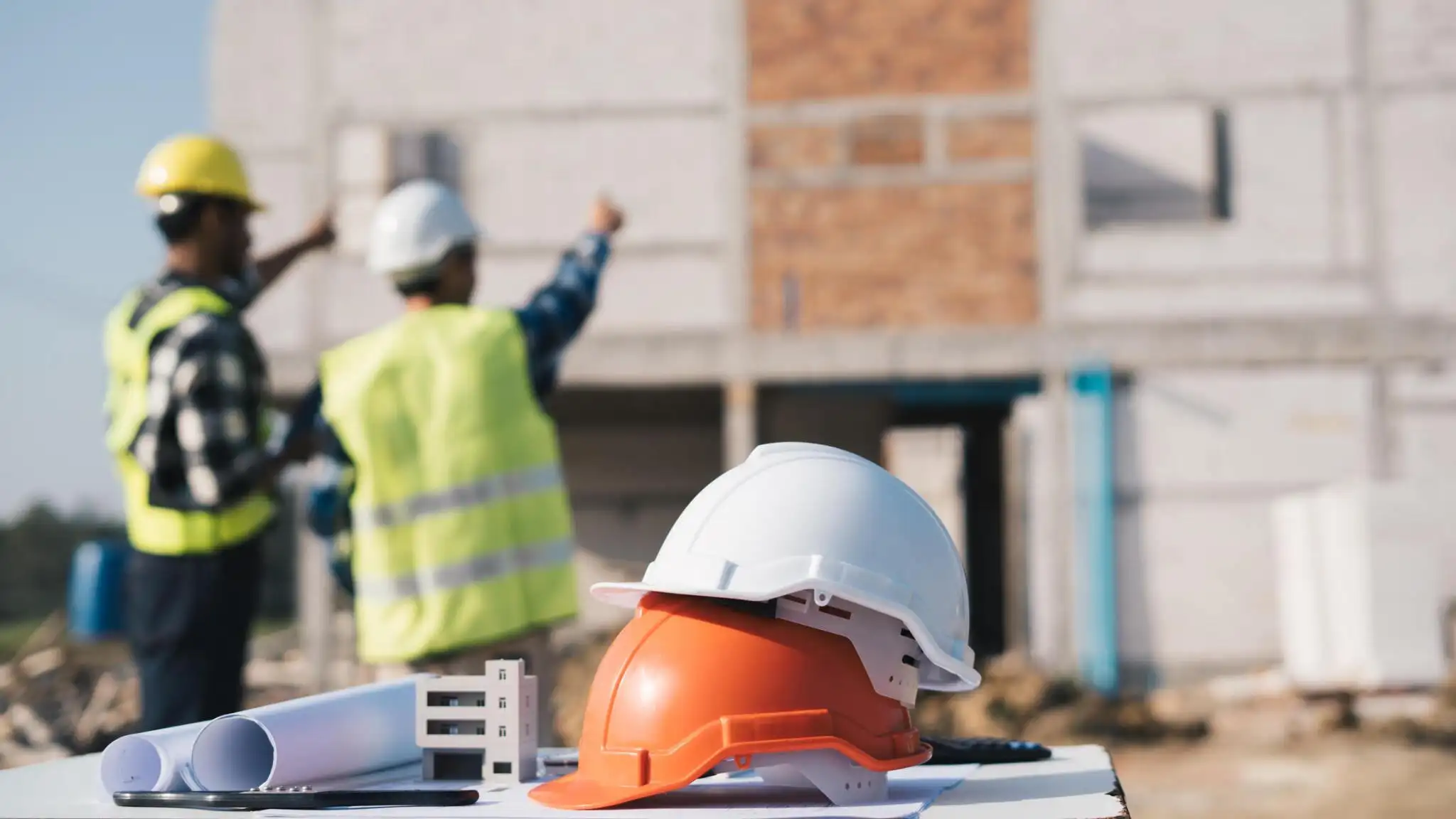 Local contractors reviewing a job site